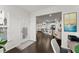 Open-concept living area with hardwood floors leading to the kitchen and a bright dining area at 216 Ellis Ln, Woodstock, GA 30189