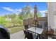 Cozy outdoor patio with a table, umbrella, and a barbecue grill at 216 Ellis Ln, Woodstock, GA 30189