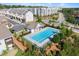 A refreshing pool with clear blue water invites relaxation among townhomes and landscaped grounds at 216 Ellis Ln, Woodstock, GA 30189