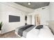 Bedroom with ceiling fan, large window offering city views, and modern tv mounted on the wall at 250 Pharr Ne Rd # 905, Atlanta, GA 30305