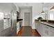 Modern kitchen with stainless steel appliances and a view of the entryway at 250 Pharr Ne Rd # 905, Atlanta, GA 30305