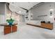 The bright and inviting lobby with a marble reception desk and modern lighting at 250 Pharr Ne Rd # 905, Atlanta, GA 30305
