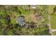 Aerial view showcases the home nestled among lush green trees, highlighting its natural surroundings at 285 Willow Shoals Dr, Covington, GA 30016