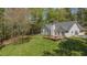 Backyard exterior showing the deck and well-maintained lawn, perfect for outdoor activities and enjoying nature at 285 Willow Shoals Dr, Covington, GA 30016
