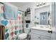 Cozy bathroom with a shower and cabinet storage at 285 Willow Shoals Dr, Covington, GA 30016