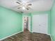 This bedroom has wood floors, a ceiling fan, and closet at 285 Willow Shoals Dr, Covington, GA 30016
