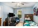 Bedroom featuring a light blue wall, ceiling fan, and a window view at 285 Willow Shoals Dr, Covington, GA 30016