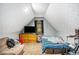 Upstairs bedroom with converted attic style ceiling and a television at 285 Willow Shoals Dr, Covington, GA 30016