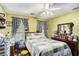 Cozy bedroom featuring a ceiling fan and a comfy quilt at 285 Willow Shoals Dr, Covington, GA 30016