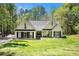 Charming single-Gathering home featuring a well-manicured lawn and inviting curb appeal with mature landscaping at 285 Willow Shoals Dr, Covington, GA 30016