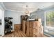 The living room is full of moving boxes and also features wood floors and natural lighting at 285 Willow Shoals Dr, Covington, GA 30016