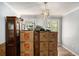 The living room is full of moving boxes and also features wood floors and natural lighting at 285 Willow Shoals Dr, Covington, GA 30016