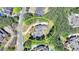 Aerial view showing the property surrounded by lush greenery, offering privacy and seclusion at 4505 Whitestone Way, Suwanee, GA 30024