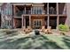 Expansive backyard patio with outdoor seating and a fire pit, perfect for entertaining guests at 4505 Whitestone Way, Suwanee, GA 30024