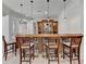This home features a finished bar with stone accents, wood bar top and seating for four at 4505 Whitestone Way, Suwanee, GA 30024