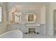 Bright bathroom featuring double sinks, a vanity, and lots of cabinet space at 4505 Whitestone Way, Suwanee, GA 30024