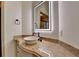 Contemporary bathroom with an illuminated mirror and vessel sink on a marble countertop at 4505 Whitestone Way, Suwanee, GA 30024