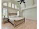 Tranquil bedroom with high ceilings, large windows, and stylish furnishings at 4505 Whitestone Way, Suwanee, GA 30024