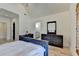 Bedroom with vaulted ceiling, hardwood floors, with a desk and dresser set at 4505 Whitestone Way, Suwanee, GA 30024