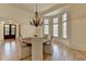 Dining room features hardwood floors, bay window, and chandelier lighting at 4505 Whitestone Way, Suwanee, GA 30024