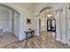 Spacious foyer with elegant columns, marble floors, and a chandelier at 4505 Whitestone Way, Suwanee, GA 30024