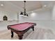 This game room features a billiard table, recessed lights and bead-board wainscoting at 4505 Whitestone Way, Suwanee, GA 30024