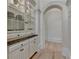Hallway with white cabinets and shelves leading to a hall at 4505 Whitestone Way, Suwanee, GA 30024