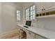 Bright office space with built-in desk, storage, and a sun-filled window at 4505 Whitestone Way, Suwanee, GA 30024