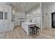 Large, luxurious kitchen with white cabinetry, a spacious island, and modern appliances at 4505 Whitestone Way, Suwanee, GA 30024