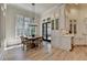 Eat-in kitchen with a beautiful view, large window, a breakfast table, and white cabinetry at 4505 Whitestone Way, Suwanee, GA 30024