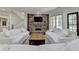 Bright living room with stone fireplace and staircase at 4505 Whitestone Way, Suwanee, GA 30024
