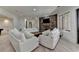 Living room featuring a stone fireplace and staircase at 4505 Whitestone Way, Suwanee, GA 30024