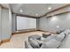 In-home movie theater boasts a large screen and comfortable seating for watching your favorite movies at 4505 Whitestone Way, Suwanee, GA 30024