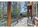 Relaxing outdoor patio with stone flooring and wrought iron railing overlooking lush yard at 4505 Whitestone Way, Suwanee, GA 30024