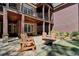 Multi-level backyard patio with a fire pit and ample seating, offering views of the surrounding landscape at 4505 Whitestone Way, Suwanee, GA 30024