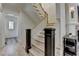 Elegant staircase with wooden steps, white railings, and dark wood accents at 4505 Whitestone Way, Suwanee, GA 30024