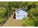Aerial shot of house showing backyard and surrounding greenery in a wooded area at 8211 Thompson St, Douglasville, GA 30134
