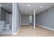 Finished basement area featuring light wood flooring, a bathroom, and walkout access at 8211 Thompson St, Douglasville, GA 30134