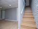 View of basement stairs with wooden steps and painted risers at 8211 Thompson St, Douglasville, GA 30134