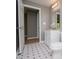 Bathroom with a single vanity, toilet and access to more rooms at 8211 Thompson St, Douglasville, GA 30134