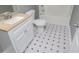 Bathroom with white vanity, stylish tile floor, toilet, and a shower at 8211 Thompson St, Douglasville, GA 30134