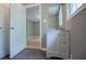 Bathroom featuring a modern vanity with drawers, mirror, and open doorway at 8211 Thompson St, Douglasville, GA 30134