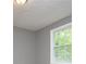 Neutral-colored room featuring a window with bright natural light at 8211 Thompson St, Douglasville, GA 30134