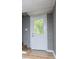 Exterior basement door with glass inset and painted brick facade at 8211 Thompson St, Douglasville, GA 30134