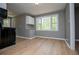 Bright kitchen features wood flooring, gray walls, and window view at 8211 Thompson St, Douglasville, GA 30134