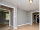 Bright living room with hardwood floors, gray walls, and natural light from a window at 8211 Thompson St, Douglasville, GA 30134