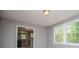 Inviting living area with hardwood floors, neutral gray walls, and lots of natural light at 8211 Thompson St, Douglasville, GA 30134