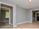 Bright living room with hardwood floors, neutral gray walls, and plenty of natural light at 8211 Thompson St, Douglasville, GA 30134