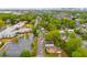Aerial view of the neighborhood with mature trees and city skyline in the distance at 926 Welch Sw St, Atlanta, GA 30310