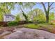 Wide backyard featuring a fire pit, grassy area, partial fence and view of the house at 926 Welch Sw St, Atlanta, GA 30310